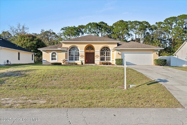 view of front facade with a garage and a front yard