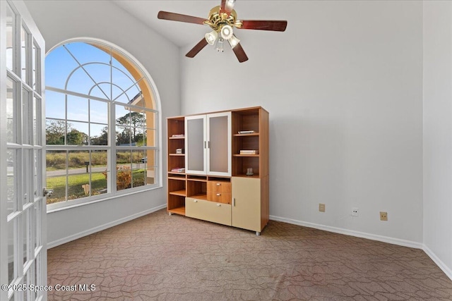 interior space featuring ceiling fan