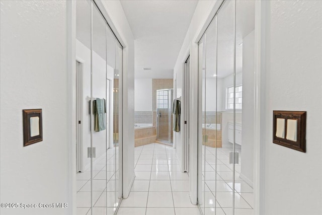 corridor with light tile patterned floors