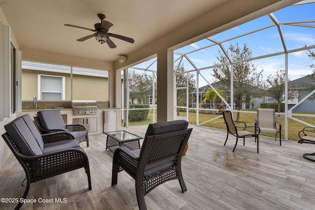 sunroom with sink and ceiling fan