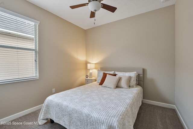 bedroom with ceiling fan and carpet