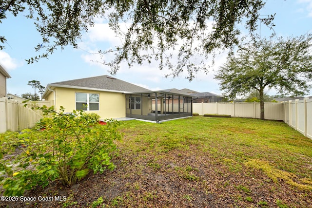 back of property featuring a patio area and a yard