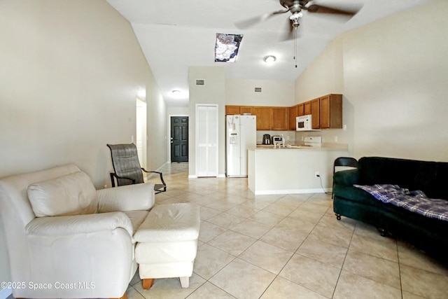 tiled living room featuring high vaulted ceiling and ceiling fan