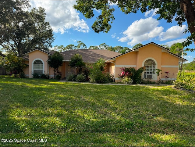 ranch-style house with a front yard