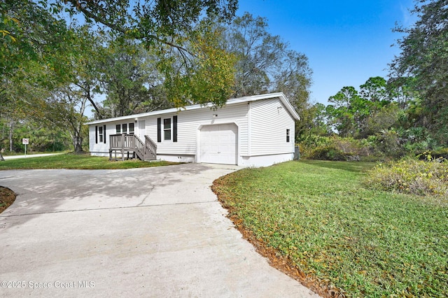 view of front facade with a garage and a front yard