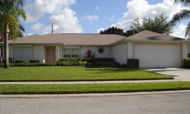 ranch-style house with a garage and a front yard