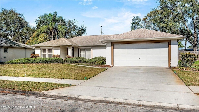 ranch-style house featuring stucco siding, a shingled roof, concrete driveway, a front yard, and a garage