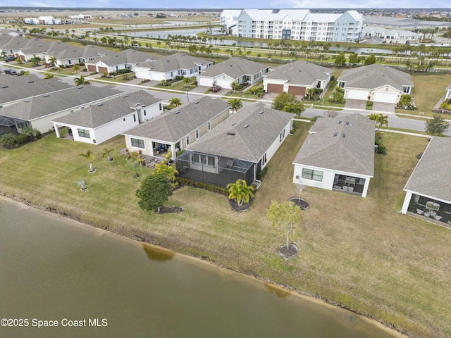 drone / aerial view with a water view