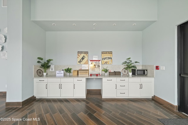 bar with white cabinetry