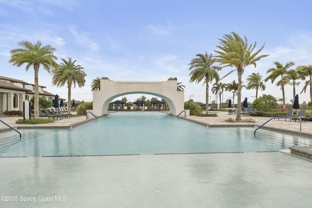 view of swimming pool featuring a patio area