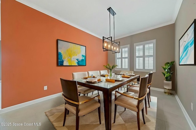 dining room with crown molding and a chandelier