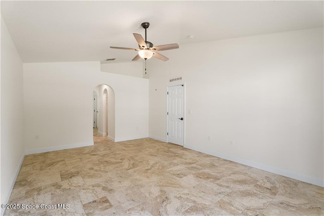 spare room featuring vaulted ceiling and ceiling fan