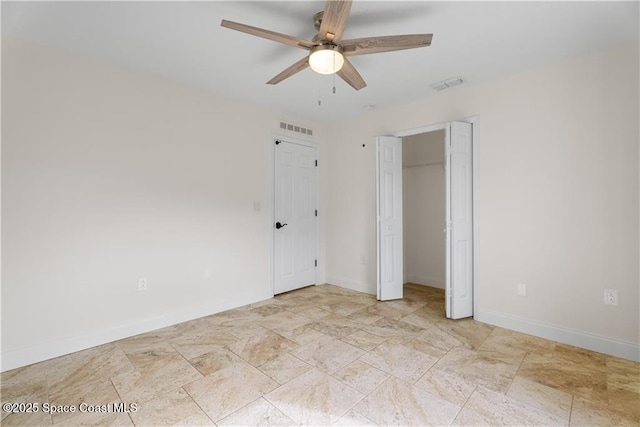 unfurnished bedroom featuring ceiling fan