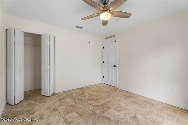 unfurnished bedroom featuring ceiling fan