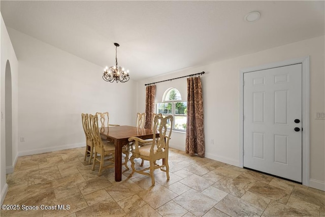 dining area with a notable chandelier