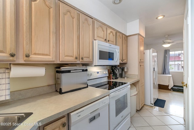 kitchen with ceiling fan, light tile patterned floors, light brown cabinetry, and white appliances