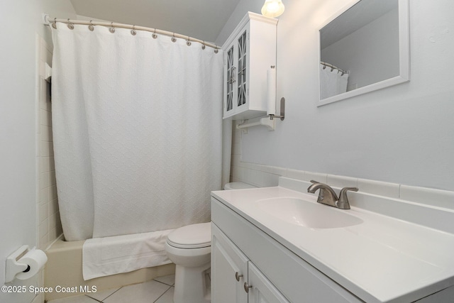 full bathroom with vanity, toilet, tile patterned flooring, and shower / bath combo