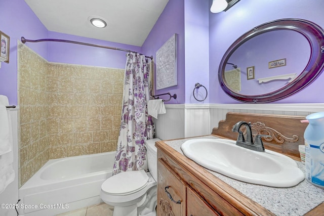 full bathroom featuring shower / bath combination with curtain, vanity, and toilet