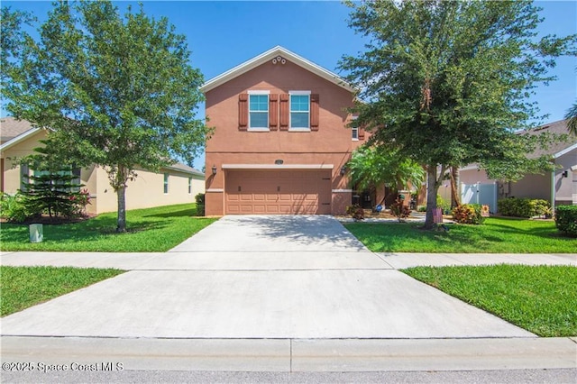 view of front of property featuring a garage and a front yard