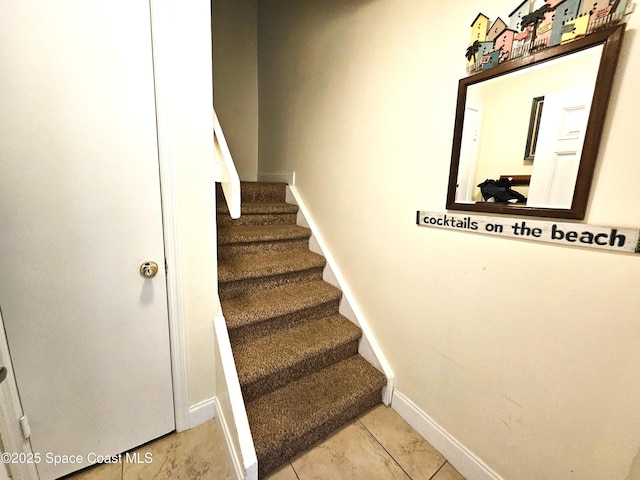 staircase with tile patterned flooring