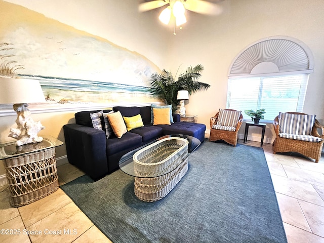 living room with ceiling fan and tile patterned flooring