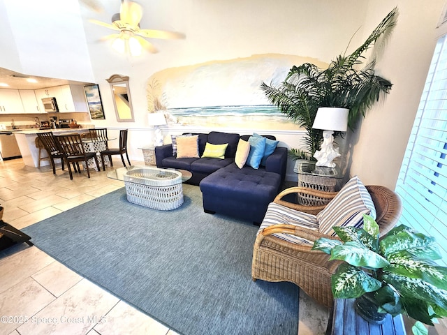 living room featuring light tile patterned flooring and ceiling fan