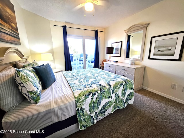 carpeted bedroom featuring a textured ceiling and ceiling fan