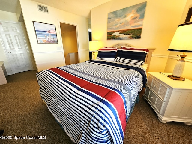 bedroom with dark carpet