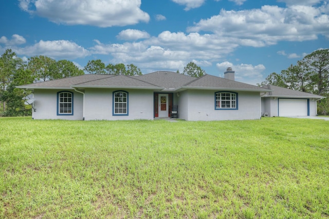 ranch-style home featuring a garage and a front yard