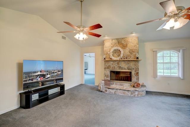 carpeted living room with ceiling fan, lofted ceiling, and a fireplace