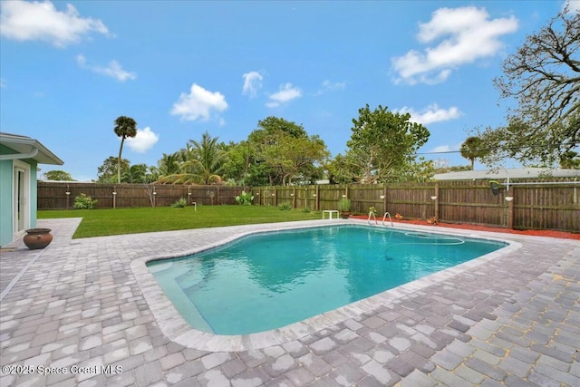 view of pool featuring a patio and a lawn