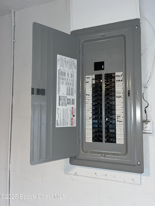 utility room featuring electric panel