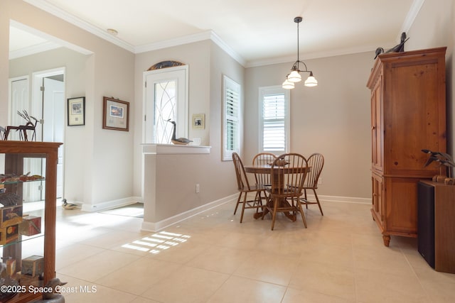 dining room featuring crown molding, light tile patterned flooring, and baseboards