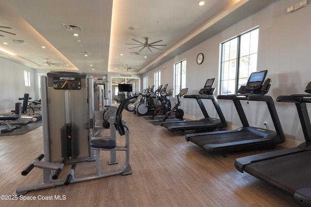 gym with recessed lighting, visible vents, a ceiling fan, and wood finished floors