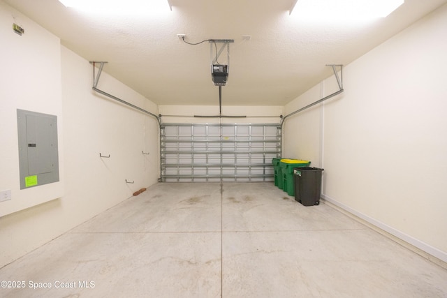 garage with a garage door opener and electric panel