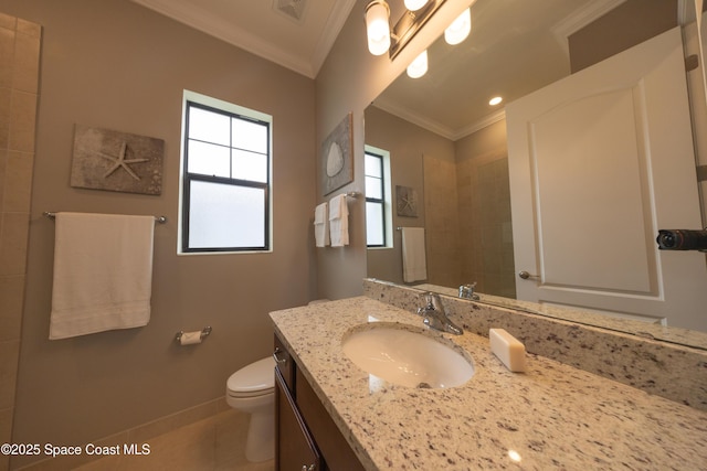 bathroom featuring visible vents, baseboards, ornamental molding, toilet, and vanity