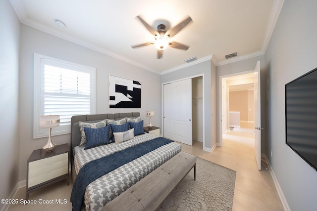 bedroom featuring baseboards, visible vents, a closet, and crown molding