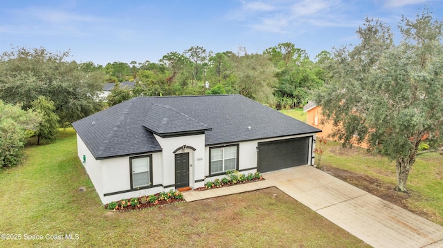 view of front of home with a garage and a front yard