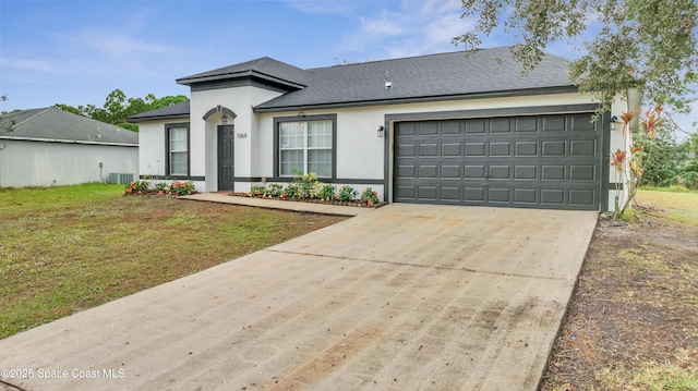 view of front of home featuring a garage and a front yard