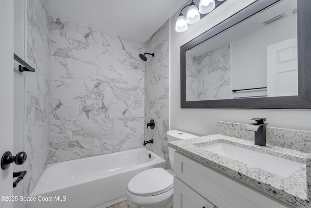 full bathroom with vanity, toilet, and tiled shower / bath combo