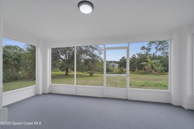 unfurnished sunroom with plenty of natural light