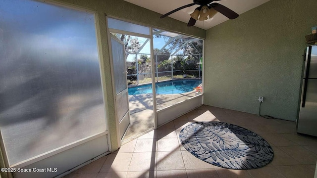 view of swimming pool featuring ceiling fan