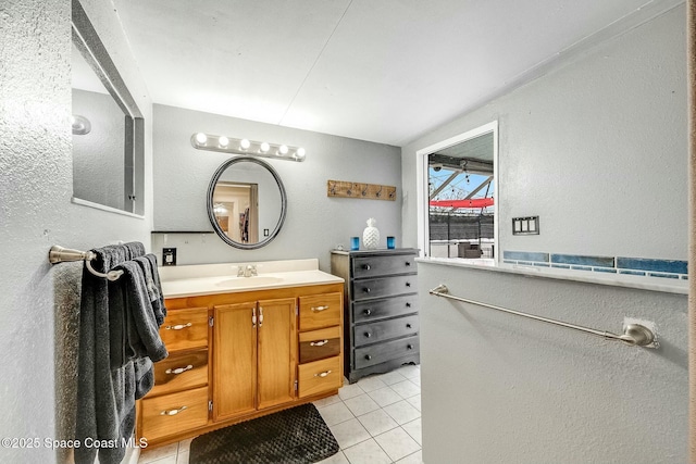 bathroom with vanity and tile patterned floors