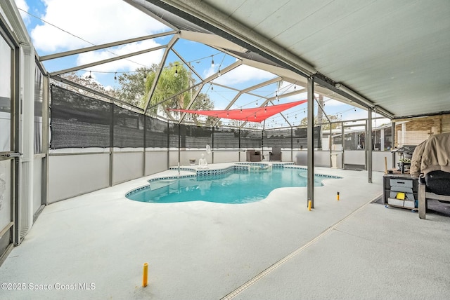 view of swimming pool with a lanai, a patio area, and a hot tub