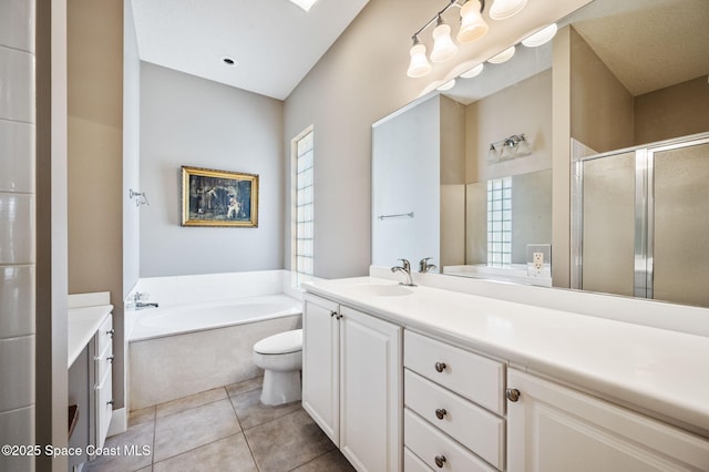 full bathroom with vanity, tile patterned floors, shower with separate bathtub, and toilet