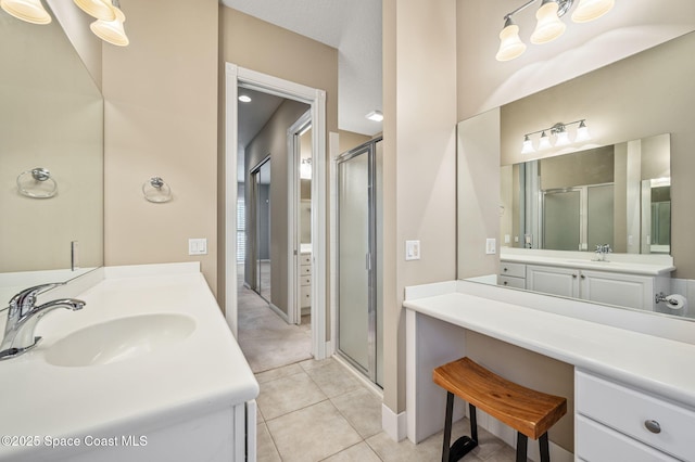 bathroom featuring vanity, an enclosed shower, and tile patterned flooring