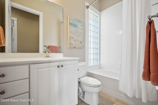 full bathroom featuring shower / bathtub combination with curtain, tile patterned floors, toilet, and vanity