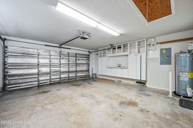 garage with a garage door opener, electric water heater, and electric panel