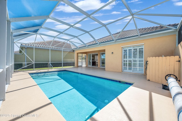 view of pool with a lanai and a patio area