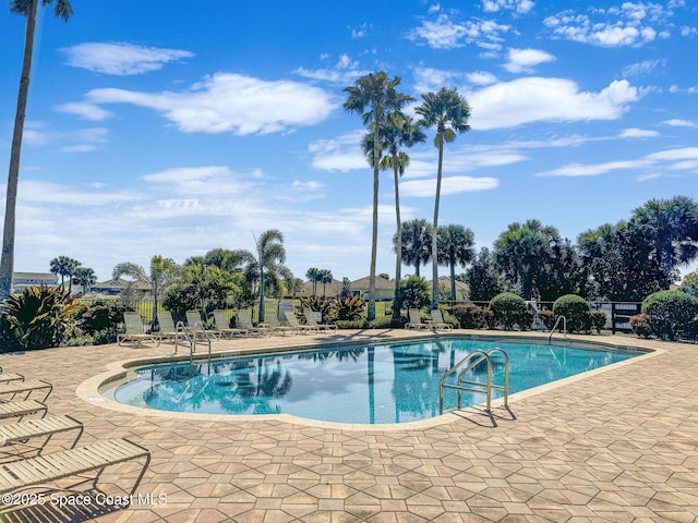 view of swimming pool with a patio